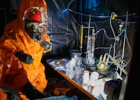 Sgt. Anthony Luiken, 103rd Civil Support Team, and Staff Sgt. Jonathan Ramos, 103rd CST, collect and seal samples at a simulated incident at the Anchorage Fire Training Center, May 19, in support of Exercise ORCA 2021. ORCA is a chemical, biological, radioactive, nuclear threats response exercise designed for participants to provide support in the aftermath of hazardous materials incidents. ORCA tests interoperability between agencies, increases opportunities for working relationships, and practices requests for assistance methods. Approximately 250 National Guardsmen from CST units in Alaska, California, Connecticut, Colorado, Idaho, Ohio, Oregon, Rhode Island, South Carolina, South Dakota, Washington, and Wisconsin are in Alaska to participate in Exercise ORCA 2021. Numerous support units and civilian agencies participated in the exercise as well. (U.S. Army National Guard photo by Spc. Grace Nechanicky)