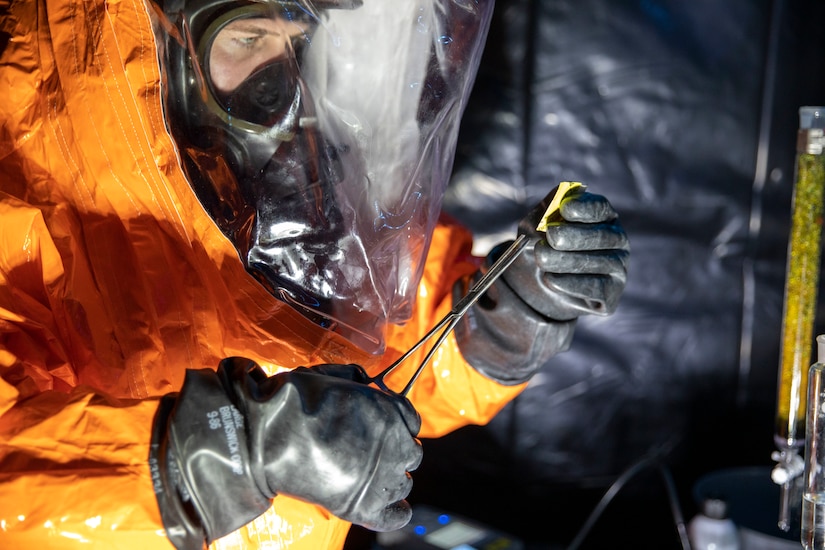 Sgt. Anthony Luiken, 103rd Civil Support Team, and Staff Sgt. Jonathan Ramos, 103rd CST, collect and seal samples at a simulated incident at the Anchorage Fire Training Center, May 19, in support of Exercise ORCA 2021. ORCA is a chemical, biological, radioactive, nuclear threats response exercise designed for participants to provide support in the aftermath of hazardous materials incidents. ORCA tests interoperability between agencies, increases opportunities for working relationships, and practices requests for assistance methods. Approximately 250 National Guardsmen from CST units in Alaska, California, Connecticut, Colorado, Idaho, Ohio, Oregon, Rhode Island, South Carolina, South Dakota, Washington, and Wisconsin are in Alaska to participate in Exercise ORCA 2021. Numerous support units and civilian agencies participated in the exercise as well. (U.S. Army National Guard photo by Spc. Grace Nechanicky)
