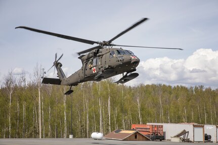 An HH-60M Black Hawk MEDEVAC helicopter from 1st Battalion, 207th Aviation Regiment, Alaska Army National Guard, lands at the Mat-Su Fire Training Site in Wasilla, Alaska, May 18, to extract a simulated casualty during Exercise ORCA 2021. ORCA is a chemical, biological, radioactive, nuclear threats response exercise designed for participants to provide support in the aftermath of hazardous materials incidents. ORCA tests interoperability between agencies, increases opportunities for working relationships, and practices requests for assistance methods. Approximately 250 National Guardsmen from CST units in Alaska, California, Connecticut, Colorado, Idaho, Ohio, Oregon, Rhode Island, South Carolina, South Dakota, Washington, and Wisconsin are in Alaska to participate in Exercise ORCA 2021. Numerous support units and civilian agencies participated in the exercise as well. (U.S. Army National Guard photo by Edward Eagerton)