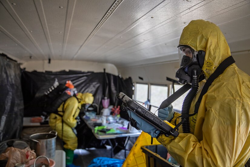 Staff Sgt. Logan Gladfeather (foreground) and Tech. Sgt. David Hurst, team members of the 52nd Civil Support Team, Ohio National Guard, survey a bus at the Mat-Su Fire Training Center in Wasilla, Alaska, May 19, during Exercise ORCA 2021. ORCA is a chemical, biological, radioactive, nuclear threats response exercise designed for participants to provide support in the aftermath of hazardous materials incidents. ORCA tests interoperability between agencies, increases opportunities for working relationships, and practices requests for assistance methods. Approximately 250 National Guardsmen from CST units in Alaska, California, Connecticut, Colorado, Idaho, Ohio, Oregon, Rhode Island, South Carolina, South Dakota, Washington, and Wisconsin are in Alaska to participate in Exercise ORCA 2021. Numerous support units and civilian agencies participated in the exercise as well. (U.S. Army National Guard photo by Edward Eagerton)