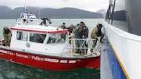 The Seward Alaska Fire Department transport members of the 13th Civil Support Team, Rhode Island National Guard, out to a simulated incident site aboard the Glacier Express vessel cruising through Resurrection Bay off of the coast of Seward, Alaska, May 19, in support of Exercise ORCA 21. ORCA is a chemical, biological, radioactive, nuclear threats response exercise designed for participants to provide support in the aftermath of hazardous materials incidents. ORCA tests interoperability between agencies, increases opportunities for working relationships, and practices requests for assistance methods. Approximately 250 National Guardsmen from CST units in Alaska, California, Connecticut, Colorado, Idaho, Ohio, Oregon, Rhode Island, South Carolina, South Dakota, Washington, and Wisconsin are in Alaska to participate in Exercise ORCA 2021. Numerous support units and civilian agencies participated in the exercise as well. (U.S. Army National Guard photo by Dana Rosso)