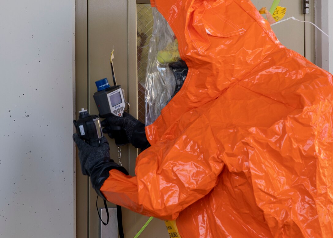 Tech Sgt. Eric McComb, 103rd Civil Support Team, prepares to enter a building to respond to a simulated incident at a parking garage on the University of Alaska Anchorage campus May 18 in support of Exercise ORCA 2021. ORCA is a chemical, biological, radioactive, nuclear threats response exercise designed for participants to provide support in the aftermath of hazardous materials incidents. ORCA tests interoperability between agencies, increases opportunities for working relationships, and practices requests for assistance methods. Approximately 250 National Guardsmen from CST units in Alaska, California, Connecticut, Colorado, Idaho, Ohio, Oregon, Rhode Island, South Carolina, South Dakota, Washington, and Wisconsin are in Alaska to participate in Exercise ORCA 2021. Numerous support units and civilian agencies participated in the exercise as well. (U.S. Army National Guard photo by Spc. Grace Nechanicky)