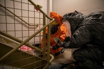 Tech Sgt. Eric McComb, 103rd Civil Support Team, and Sgt. Andrew Hunt, 103rd CST, respond to a simulated incident at a parking garage on the University of Alaska Anchorage campus May 18 in support of Exercise ORCA 2021. ORCA is a chemical, biological, radioactive, nuclear threats response exercise designed for participants to provide support in the aftermath of hazardous materials incidents. ORCA tests interoperability between agencies, increases opportunities for working relationships, and practices requests for assistance methods. Approximately 250 National Guardsmen from CST units in Alaska, California, Connecticut, Colorado, Idaho, Ohio, Oregon, Rhode Island, South Carolina, South Dakota, Washington, and Wisconsin are in Alaska to participate in Exercise ORCA 2021. Numerous support units and civilian agencies participated in the exercise as well. (U.S. Army National Guard photo by Spc. Grace Nechanicky)