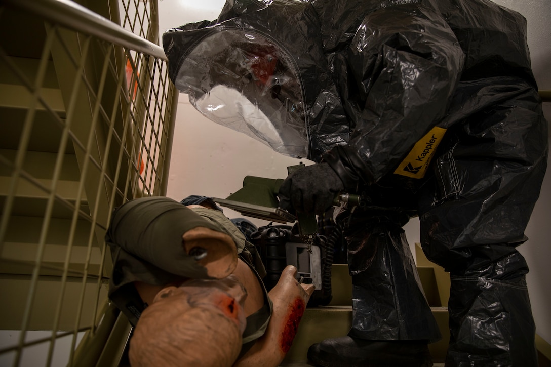 Sgt. Andrew Hunt, 103rd Civil Support Team, responds to a simulated incident at a parking garage on the University of Alaska Anchorage campus May 18 in support of Exercise ORCA 2021. ORCA is a chemical, biological, radioactive, nuclear threats response exercise designed for participants to provide support in the aftermath of hazardous materials incidents. ORCA tests interoperability between agencies, increases opportunities for working relationships, and practices requests for assistance methods. Approximately 250 National Guardsmen from CST units in Alaska, California, Connecticut, Colorado, Idaho, Ohio, Oregon, Rhode Island, South Carolina, South Dakota, Washington, and Wisconsin are in Alaska to participate in Exercise ORCA 2021. Numerous support units and civilian agencies participated in the exercise as well. (U.S. Army National Guard photo by Spc. Grace Nechanicky)