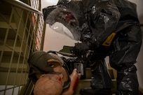 Sgt. Andrew Hunt, 103rd Civil Support Team, responds to a simulated incident at a parking garage on the University of Alaska Anchorage campus May 18 in support of Exercise ORCA 2021. ORCA is a chemical, biological, radioactive, nuclear threats response exercise designed for participants to provide support in the aftermath of hazardous materials incidents. ORCA tests interoperability between agencies, increases opportunities for working relationships, and practices requests for assistance methods. Approximately 250 National Guardsmen from CST units in Alaska, California, Connecticut, Colorado, Idaho, Ohio, Oregon, Rhode Island, South Carolina, South Dakota, Washington, and Wisconsin are in Alaska to participate in Exercise ORCA 2021. Numerous support units and civilian agencies participated in the exercise as well. (U.S. Army National Guard photo by Spc. Grace Nechanicky)