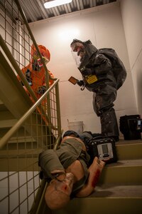 Tech Sgt. Eric McComb, 103rd Civil Support Team, and Sgt. Andrew Hunt, 103rd CST, respond to a simulated incident at a parking garage on the University of Alaska Anchorage campus May 18 in support of Exercise ORCA 2021. ORCA is a chemical, biological, radioactive, nuclear threats response exercise designed for participants to provide support in the aftermath of hazardous materials incidents. ORCA tests interoperability between agencies, increases opportunities for working relationships, and practices requests for assistance methods. Approximately 250 National Guardsmen from CST units in Alaska, California, Connecticut, Colorado, Idaho, Ohio, Oregon, Rhode Island, South Carolina, South Dakota, Washington, and Wisconsin are in Alaska to participate in Exercise ORCA 2021. Numerous support units and civilian agencies participated in the exercise as well. (U.S. Army National Guard photo by Spc. Grace Nechanicky)