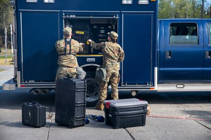 Sgt. Jason Williams, 103rd Civil Support Team, and Senior Airman Scottie Branson, 176th Civil Engineering Squadron, prepare gear to respond to a simulated incident at a parking garage on the University of Alaska Anchorage campus May 18, in support of Exercise ORCA 2021. ORCA is a chemical, biological, radioactive, nuclear threats response exercise designed for participants to provide support in the aftermath of hazardous materials incidents. ORCA tests interoperability between agencies, increases opportunities for working relationships, and practices requests for assistance methods. Approximately 250 National Guardsmen from CST units in Alaska, California, Connecticut, Colorado, Idaho, Ohio, Oregon, Rhode Island, South Carolina, South Dakota, Washington, and Wisconsin are in Alaska to participate in Exercise ORCA 2021. Numerous support units and civilian agencies participated in the exercise as well. (U.S. Army National Guard photo by Spc. Grace Nechanicky)