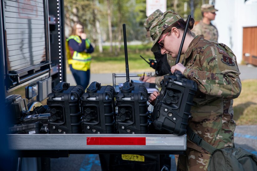 Sgt. Jason Williams, 103rd Civil Support Team, and Senior Airman Scottie Branson, 176th Civil Engineering Squadron, prepare gear to respond to a simulated incident at a parking garage on the University of Alaska Anchorage campus May 18, in support of Exercise ORCA 2021. ORCA is a chemical, biological, radioactive, nuclear threats response exercise designed for participants to provide support in the aftermath of hazardous materials incidents. ORCA tests interoperability between agencies, increases opportunities for working relationships, and practices requests for assistance methods. Approximately 250 National Guardsmen from CST units in Alaska, California, Connecticut, Colorado, Idaho, Ohio, Oregon, Rhode Island, South Carolina, South Dakota, Washington, and Wisconsin are in Alaska to participate in Exercise ORCA 2021. Numerous support units and civilian agencies participated in the exercise as well. (U.S. Army National Guard photo by Spc. Grace Nechanicky)