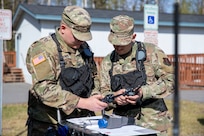 Sgt. Andrew Hunt, 103rd Civil Support Team, and Tech Sgt. Eric McComb, 103rd CST, prepare gear to respond to a simulated incident at a parking garage on the University of Alaska Anchorage campus May 18 in support of Exercise ORCA 2021. ORCA is a chemical, biological, radioactive, nuclear threats response exercise designed for participants to provide support in the aftermath of hazardous materials incidents. ORCA tests interoperability between agencies, increases opportunities for working relationships, and practices requests for assistance methods. Approximately 250 National Guardsmen from CST units in Alaska, California, Connecticut, Colorado, Idaho, Ohio, Oregon, Rhode Island, South Carolina, South Dakota, Washington, and Wisconsin are in Alaska to participate in Exercise ORCA 2021. Numerous support units and civilian agencies participated in the exercise as well. (U.S. Army National Guard photo by Spc. Grace Nechanicky)