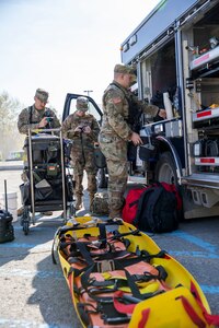 Members of the 103rd Civil Support Team prepare gear to respond to a simulated incident at a parking garage on the University of Alaska Anchorage campus May 18, in support of Exercise ORCA 2021. ORCA is a chemical, biological, radioactive, nuclear threats response exercise designed for participants to provide support in the aftermath of hazardous materials incidents. ORCA tests interoperability between agencies, increases opportunities for working relationships, and practices requests for assistance methods. Approximately 250 National Guardsmen from CST units in Alaska, California, Connecticut, Colorado, Idaho, Ohio, Oregon, Rhode Island, South Carolina, South Dakota, Washington, and Wisconsin are in Alaska to participate in Exercise ORCA 2021. Numerous support units and civilian agencies participated in the exercise as well. (U.S. Army National Guard photo by Spc. Grace Nechanicky)