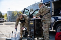 Sgt. Andrew Hunt, 103rd Civil Support Team, and Tech Sgt. Eric McComb, 103rd CST, prepare gear to respond to a simulated incident at a parking garage on the University of Alaska Anchorage campus May 18 in support of Exercise ORCA 2021. ORCA is a chemical, biological, radioactive, nuclear threats response exercise designed for participants to provide support in the aftermath of hazardous materials incidents. ORCA tests interoperability between agencies, increases opportunities for working relationships, and practices requests for assistance methods. Approximately 250 National Guardsmen from CST units in Alaska, California, Connecticut, Colorado, Idaho, Ohio, Oregon, Rhode Island, South Carolina, South Dakota, Washington, and Wisconsin are in Alaska to participate in Exercise ORCA 2021. Numerous support units and civilian agencies participated in the exercise as well. (U.S. Army National Guard photo by Spc. Grace Nechanicky)