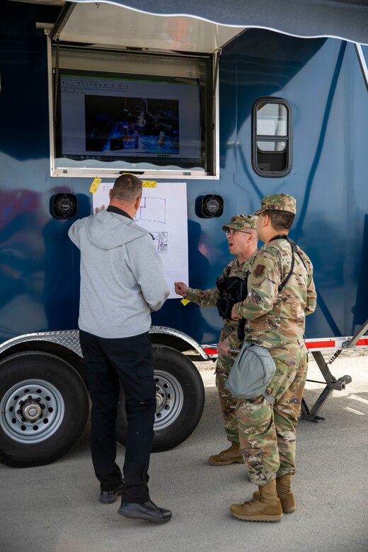 Members of the 103rd Civil Support Team conduct mission briefings before they send personnel into a tower at the Anchorage Fire Training Center to respond to a simulated incident May 19, as part of Exercise ORCA 2021. ORCA is a chemical, biological, radioactive, nuclear threats response exercise designed for participants to provide support in the aftermath of hazardous materials incidents. ORCA tests interoperability between agencies, increases opportunities for working relationships, and practices requests for assistance methods. Approximately 250 National Guardsmen from CST units in Alaska, California, Connecticut, Colorado, Idaho, Ohio, Oregon, Rhode Island, South Carolina, South Dakota, Washington, and Wisconsin are in Alaska to participate in Exercise ORCA 2021. Numerous support units and civilian agencies participated in the exercise as well. (U.S. Army National Guard photo by Spc. Grace Nechanicky)
