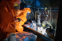 Sgt. Anthony Luiken, 103rd Civil Support Team, and Staff Sgt. Jonathan Ramos, 103rd CST, collect and seal samples at a simulated incident at the Anchorage Fire Training Center, May 19, in support of Exercise ORCA 2021. ORCA is a chemical, biological, radioactive, nuclear threats response exercise designed for participants to provide support in the aftermath of hazardous materials incidents. ORCA tests interoperability between agencies, increases opportunities for working relationships, and practices requests for assistance methods. Approximately 250 National Guardsmen from CST units in Alaska, California, Connecticut, Colorado, Idaho, Ohio, Oregon, Rhode Island, South Carolina, South Dakota, Washington, and Wisconsin are in Alaska to participate in Exercise ORCA 2021. Numerous support units and civilian agencies participated in the exercise as well. (U.S. Army National Guard photo by Spc. Grace Nechanicky)