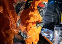 Sgt. Anthony Luiken, 103rd Civil Support Team, and Staff Sgt. Jonathan Ramos, 103rd CST, collect and seal samples at a simulated incident at the Anchorage Fire Training Center, May 19, in support of Exercise ORCA 2021. ORCA is a chemical, biological, radioactive, nuclear threats response exercise designed for participants to provide support in the aftermath of hazardous materials incidents. ORCA tests interoperability between agencies, increases opportunities for working relationships, and practices requests for assistance methods. Approximately 250 National Guardsmen from CST units in Alaska, California, Connecticut, Colorado, Idaho, Ohio, Oregon, Rhode Island, South Carolina, South Dakota, Washington, and Wisconsin are in Alaska to participate in Exercise ORCA 2021. Numerous support units and civilian agencies participated in the exercise as well. (U.S. Army National Guard photo by Spc. Grace Nechanicky)