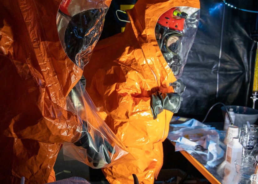 Sgt. Anthony Luiken, 103rd Civil Support Team, and Staff Sgt. Jonathan Ramos, 103rd CST, collect and seal samples at a simulated incident at the Anchorage Fire Training Center, May 19, in support of Exercise ORCA 2021. ORCA is a chemical, biological, radioactive, nuclear threats response exercise designed for participants to provide support in the aftermath of hazardous materials incidents. ORCA tests interoperability between agencies, increases opportunities for working relationships, and practices requests for assistance methods. Approximately 250 National Guardsmen from CST units in Alaska, California, Connecticut, Colorado, Idaho, Ohio, Oregon, Rhode Island, South Carolina, South Dakota, Washington, and Wisconsin are in Alaska to participate in Exercise ORCA 2021. Numerous support units and civilian agencies participated in the exercise as well. (U.S. Army National Guard photo by Spc. Grace Nechanicky)