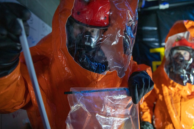 Sgt. Anthony Luiken, 103rd Civil Support Team, and Staff Sgt. Jonathan Ramos, 103rd CST, collect and seal samples at a simulated incident at the Anchorage Fire Training Center, May 19, in support of Exercise ORCA 2021. ORCA is a chemical, biological, radioactive, nuclear threats response exercise designed for participants to provide support in the aftermath of hazardous materials incidents. ORCA tests interoperability between agencies, increases opportunities for working relationships, and practices requests for assistance methods. Approximately 250 National Guardsmen from CST units in Alaska, California, Connecticut, Colorado, Idaho, Ohio, Oregon, Rhode Island, South Carolina, South Dakota, Washington, and Wisconsin are in Alaska to participate in Exercise ORCA 2021. Numerous support units and civilian agencies participated in the exercise as well. (U.S. Army National Guard photo by Spc. Grace Nechanicky)