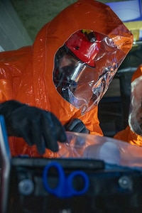 Sgt. Anthony Luiken, 103rd Civil Support Team, and Staff Sgt. Jonathan Ramos, 103rd CST, collect and seal samples at a simulated incident at the Anchorage Fire Training Center, May 19, in support of Exercise ORCA 2021. ORCA is a chemical, biological, radioactive, nuclear threats response exercise designed for participants to provide support in the aftermath of hazardous materials incidents. ORCA tests interoperability between agencies, increases opportunities for working relationships, and practices requests for assistance methods. Approximately 250 National Guardsmen from CST units in Alaska, California, Connecticut, Colorado, Idaho, Ohio, Oregon, Rhode Island, South Carolina, South Dakota, Washington, and Wisconsin are in Alaska to participate in Exercise ORCA 2021. Numerous support units and civilian agencies participated in the exercise as well. (U.S. Army National Guard photo by Spc. Grace Nechanicky)
