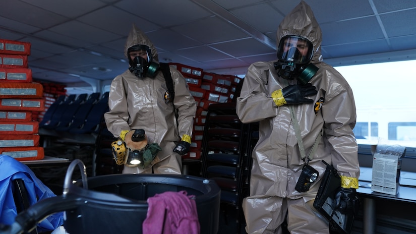Members of the 13th Civil Support, Rhode Island National Guard, Team relay information back to the team’s command post during their initial survey of the simulated incident site at the Port of Seward Drydocks in Seward, Alaska, May 18, in support of Exercise ORCA 21. ORCA is a chemical, biological, radioactive, nuclear threats response exercise designed for participants to provide support in the aftermath of hazardous materials incidents. ORCA tests interoperability between agencies, increases opportunities for working relationships and practices requests for assistance methods. Approximately 250 National Guardsmen from CST units in Alaska, California, Connecticut, Colorado, Idaho, Ohio, Oregon, Rhode Island, South Carolina, South Dakota, Washington, and Wisconsin are in Alaska to participate in Exercise ORCA 2021. Numerous support units and civilian agencies participated in the exercise as well. (U.S. Army National Guard photo by Dana Rosso)