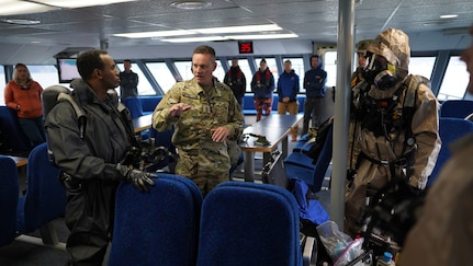 1st Sgt. Steve Freeland, 102nd Civil Support Team, Oregon National Guard, conducts a post event briefing with members of the 82nd Civil Support Team, South Dakota National Guard, and the 102nd Civil Support Team, Oregon National Guard, at the conclusion of entry into the simulated incident site aboard the Glacier Express vessel cruising through Resurrection Bay off of the coast of Seward, Alaska, May 19, in support of Exercise ORCA 21. ORCA is a chemical, biological, radioactive, nuclear threats response exercise designed for participants to provide support in the aftermath of hazardous materials incidents. ORCA tests interoperability between agencies, increases opportunities for working relationships, and practices requests for assistance methods. Approximately 250 National Guardsmen from CST units in Alaska, California, Connecticut, Colorado, Idaho, Ohio, Oregon, Rhode Island, South Carolina, South Dakota, Washington, and Wisconsin are in Alaska to participate in Exercise ORCA 2021. Numerous support units and civilian agencies participated in the exercise as well. (U.S. Army National Guard photo by Dana Rosso)