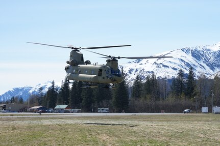 A CH-47 Chinook helicopter from 1st Battalion, 207th Aviation Regiment, Alaska Army National Guard, departs the city of Seward, Alaska, May 18, after transporting the 82nd Civil Support Team from the South Dakota National Guard in support of Exercise ORCA 21. ORCA is a chemical, biological, radioactive, nuclear threats response exercise designed for participants to provide support in the aftermath of hazardous materials incidents. ORCA tests interoperability between agencies, increases opportunities for working relationships, and practices requests for assistance methods. Approximately 250 National Guardsmen from CST units in Alaska, California, Connecticut, Colorado, Idaho, Ohio, Oregon, Rhode Island, South Carolina, South Dakota, Washington, and Wisconsin are in Alaska to participate in Exercise ORCA 2021. Numerous support units and civilian agencies participated in the exercise as well. (U.S. Army National Guard photo by Dana Rosso)
