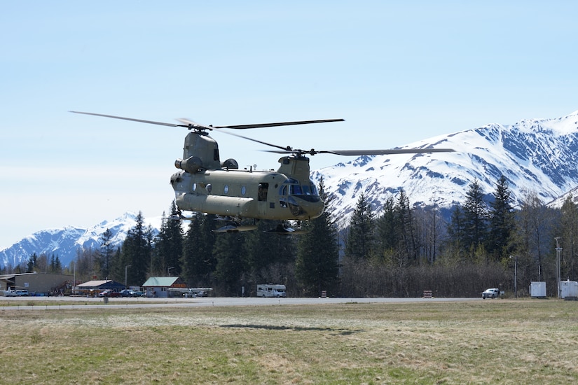 A CH-47 Chinook helicopter from 1st Battalion, 207th Aviation Regiment, Alaska Army National Guard, departs the city of Seward, Alaska, May 18, after transporting the 82nd Civil Support Team from the South Dakota National Guard in support of Exercise ORCA 21. ORCA is a chemical, biological, radioactive, nuclear threats response exercise designed for participants to provide support in the aftermath of hazardous materials incidents. ORCA tests interoperability between agencies, increases opportunities for working relationships, and practices requests for assistance methods. Approximately 250 National Guardsmen from CST units in Alaska, California, Connecticut, Colorado, Idaho, Ohio, Oregon, Rhode Island, South Carolina, South Dakota, Washington, and Wisconsin are in Alaska to participate in Exercise ORCA 2021. Numerous support units and civilian agencies participated in the exercise as well. (U.S. Army National Guard photo by Dana Rosso)