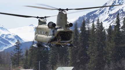 A CH-47 Chinook helicopter from 1st Battalion, 207th Aviation Regiment, Alaska Army National Guard, prepares to land in the city of Seward, Alaska, May 18, in support of Exercise ORCA 21. The CH-47 inserted the 82nd Civil Support Team from the South Dakota National Guard into Seward as the initial response team responsible for conducting a scene assessment, establishing the staging areas as well as the on-scene command post. The 82nd CST also conducted the initial entry into the incident location. ORCA is a chemical, biological, radioactive, nuclear threats response exercise designed for participants to provide support in the aftermath of hazardous materials incidents. ORCA tests interoperability between agencies, increases opportunities for working relationships, and practices requests for assistance methods. Approximately 250 National Guardsmen from CST units in Alaska, California, Connecticut, Colorado, Idaho, Ohio, Oregon, Rhode Island, South Carolina, South Dakota, Washington, and Wisconsin are in Alaska to participate in Exercise ORCA 2021. Numerous support units and civilian agencies participated in the exercise as well. (U.S. Army National Guard photo by Dana Rosso)