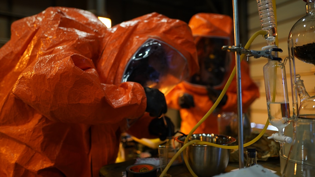 Team members of the 82nd Civil Support Team from the South Dakota National Guard takes samples of the simulated lab site while conducting initial assessment of the incident location in Seward, Alaska, May 18, in support of Exercise ORCA 21. ORCA is a chemical, biological, radioactive, nuclear threats response exercise designed for participants to provide support in the aftermath of hazardous materials incidents. ORCA tests interoperability between agencies, increases opportunities for working relationships, and practices requests for assistance methods. Approximately 250 National Guardsmen from CST units in Alaska, California, Connecticut, Colorado, Idaho, Ohio, Oregon, Rhode Island, South Carolina, South Dakota, Washington, and Wisconsin are in Alaska to participate in Exercise ORCA 2021. Numerous support units and civilian agencies participated in the exercise as well. (U.S. Army National Guard photo by Dana Rosso)