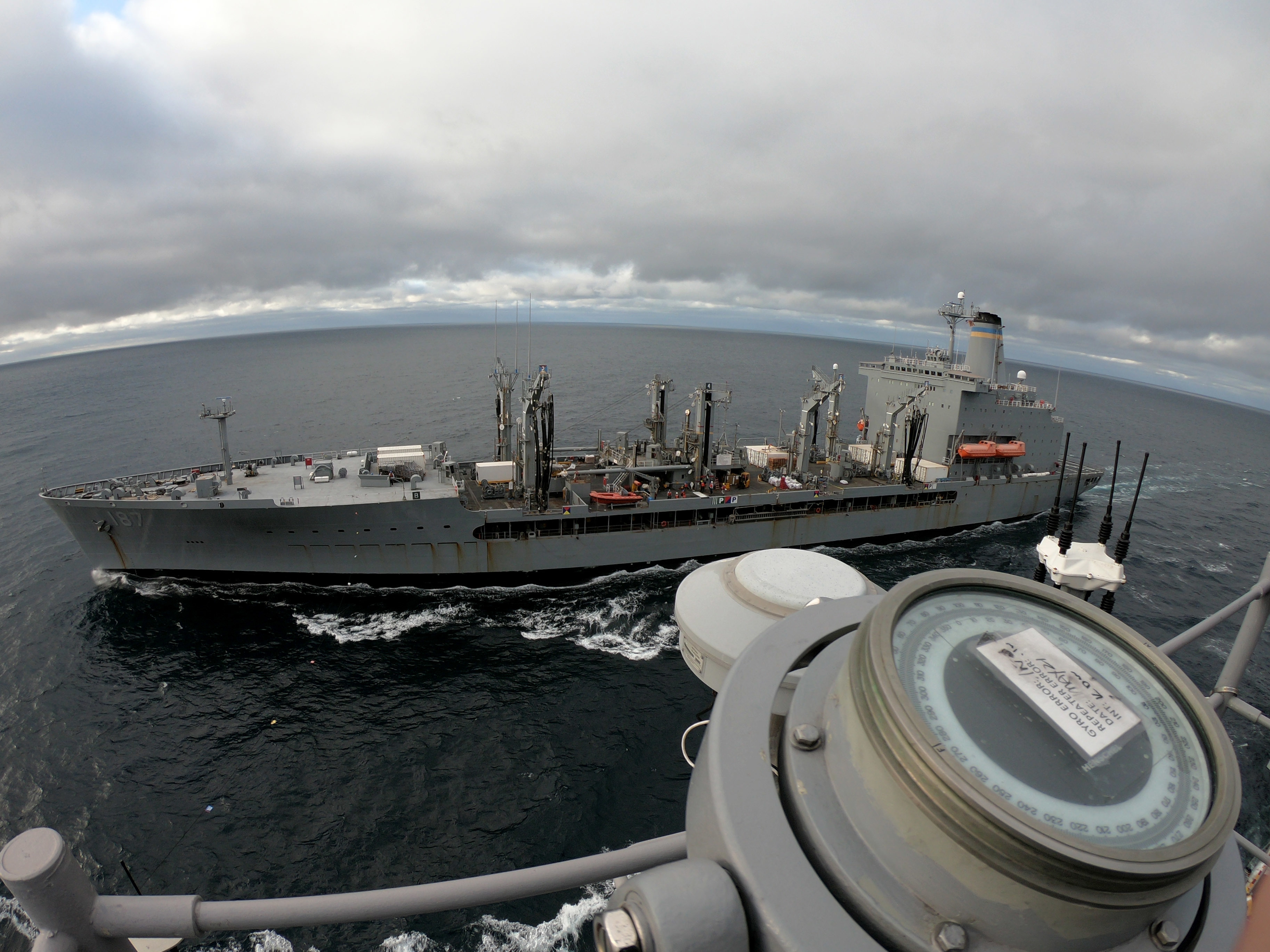 The fleet replenishment oiler USNS Henry J. Kaiser (T-AO-187) pulls alongside amphibious assault ship USS Tripoli (LHA 7) for Tripoli's first replenishment-at-sea (RAS).