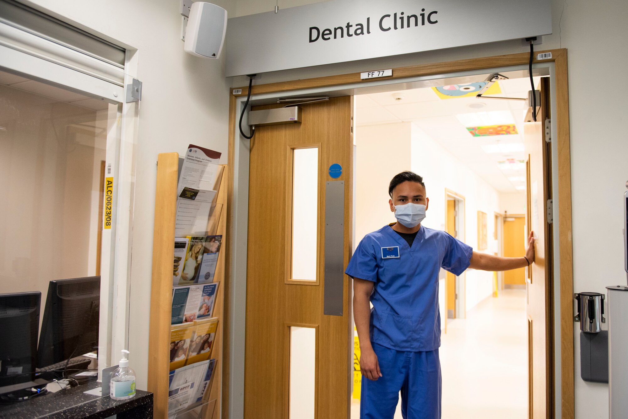 U.S. Air Force Senior Airman Mark Pinto, 423rd Medical Squadron dental technician, welcomes patients ​at Royal Air Force Alconbury, England, May 11, 2021. (U.S. Air Force photo by Senior Airman Jennifer Zima)