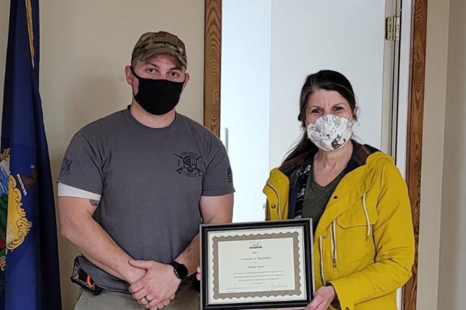 TSgt. Nathan Bourn, a munitions specialist assigned to the 158th Fighter Wing, is recognized by Beth Saradarian, executive director of the Rutland County Humane Society at the Poultney Fire Department, Poultney, VT.
