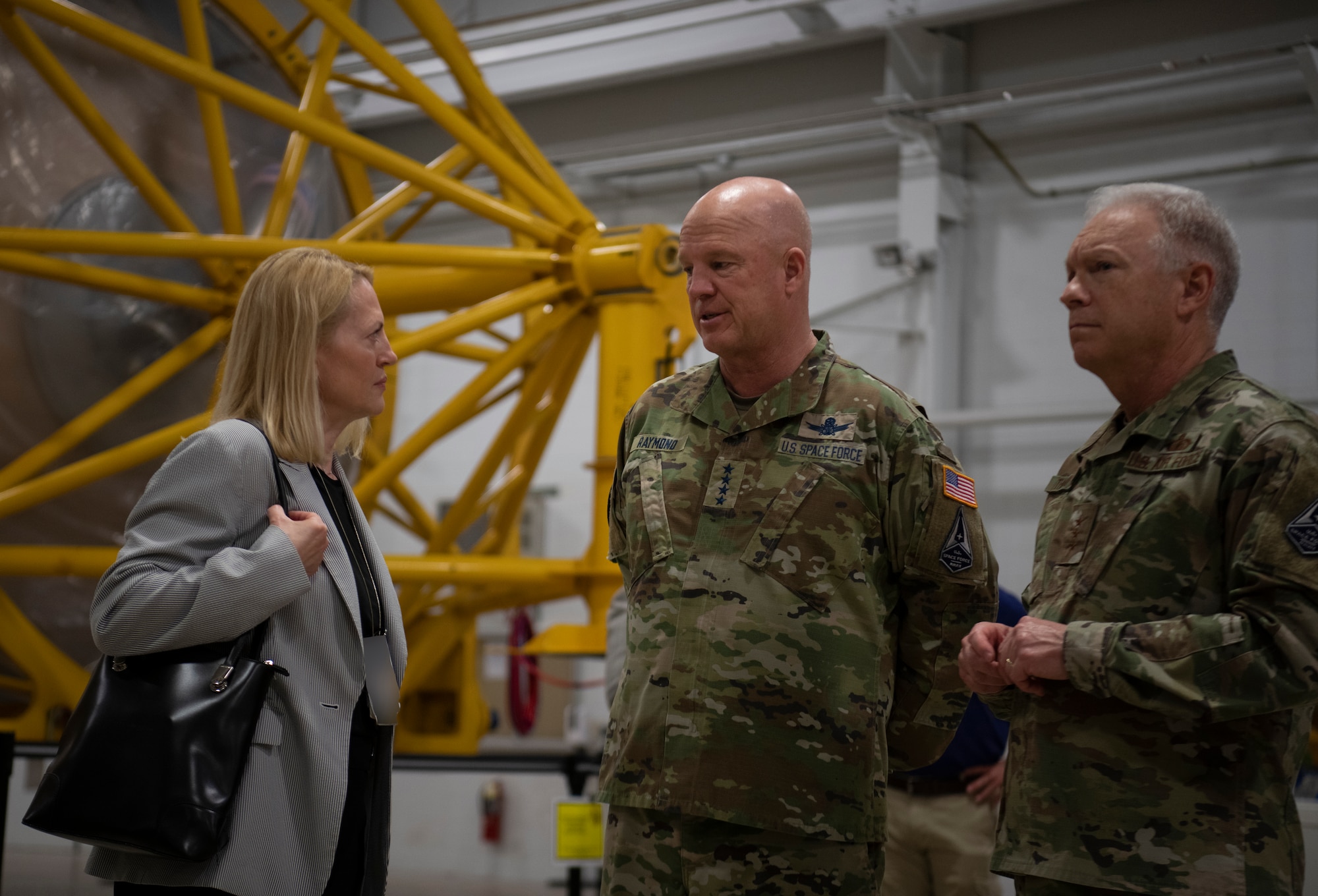 Robbie Sabathier, left, United Launch Alliance vice president of government relations and strategic communication, meets with U.S. Space Force Gen. John W. “Jay” Raymond, center, Chief of Space Operations, and Lt. Gen. John Thompson, right, Space and Missile Systems Center commander, during a tour of the Atlas Spaceflight Operations Center at Cape Canaveral Space Force Station, Fla., May 17, 2021. Raymond and Johnson toured the installation to meet with Airmen and Guardians supporting space launch operations and learn more about the partnerships between CCSFS and commercial companies. Photo altered for security purposes. (U.S. Space Force photo by Tech. Sgt. James Hodgman)