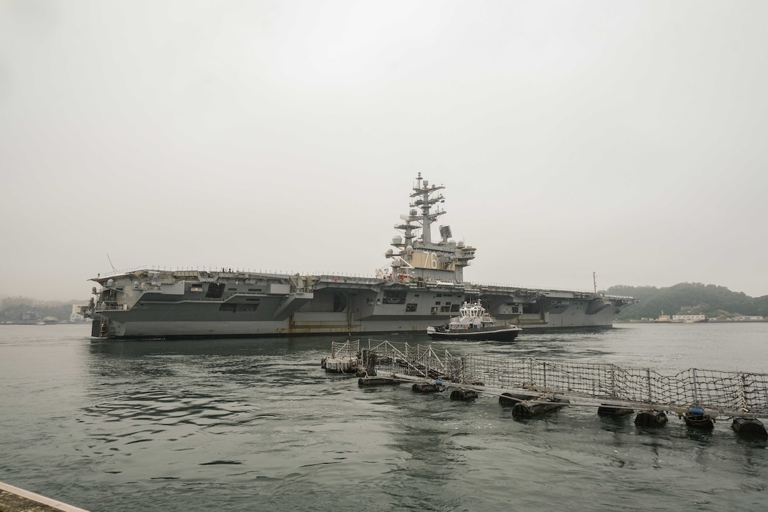 USS Ronald Reagan (CVN 76) departs Fleet Activities Yokosuka for deployment.