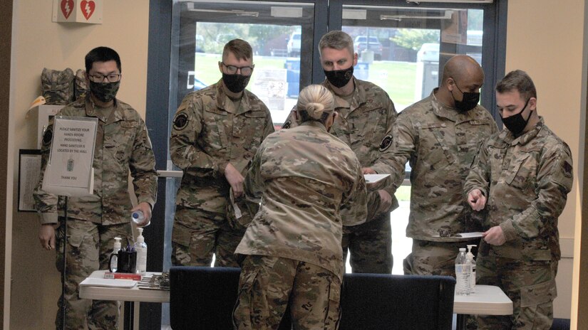 Pennsylvania Air National Guard Lt. Colonel Angela McDonough, chief of dental services and medical administration officer for the 111th Medical Group here processes members of the 111th Attack Wing for their COVID-19 vaccine at Biddle Air National Guard Base in Horsham, Pennsylvania, May 1, 2021. McDonough and her wingmen at the 111th Med Group have administered 913 total doses of the COVID-19 vaccine  on base from Jan. 27 , 2001 to May 20, 2001. (U.S. Air National Guard photo by Tech. Sgt. Tyrone Mitchell)