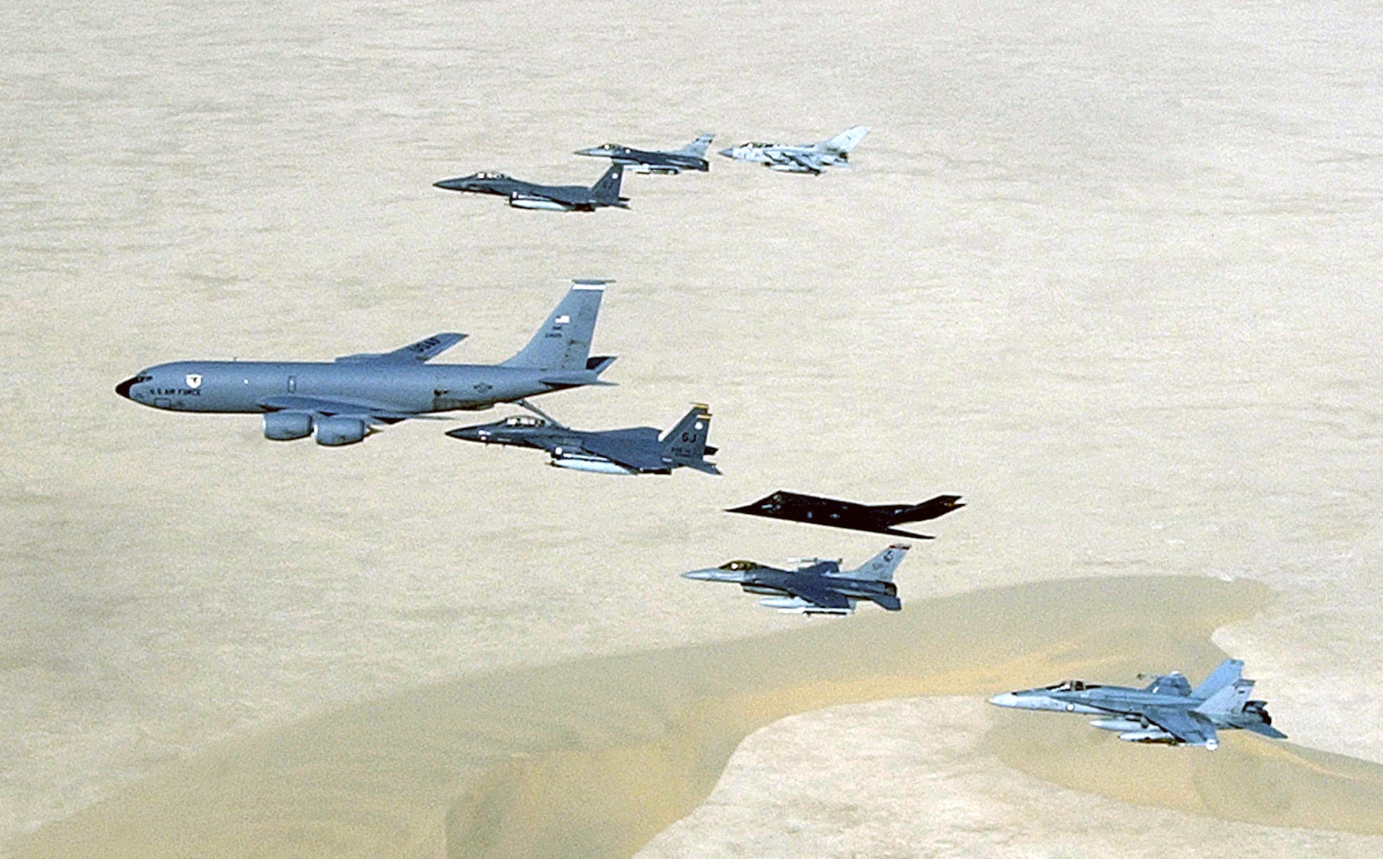 Aircraft of the 379th Air Expeditionary Wing and coalition counterparts fly over the desert in Southwest Asia on April 14, 2003. Aircraft include the KC-135 Stratotanker, F-15E Strike Eagle, F-117 Nighthawk, F-16 Fighting Falcon, British GR-4 Tornado and Australian F/A-18 Hornet. (U.S. Air Force photo/Master Sgt. Ron Przysucha)
