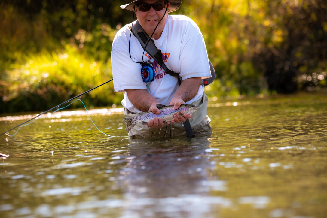 IMAGE: Steve Tegtmeyer shows off a fish caught while fly-fishing with Project Healing Waters Fly Fishing (PHWFF). Tegtmeyer, a Naval Surface Warfare Center Dahlgren Division Dam Neck Activity employee, is a recipient of the NSWCDD Distinguished Community Service Award and volunteer with PHWFF.