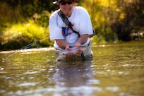 IMAGE: Steve Tegtmeyer shows off a fish caught while fly-fishing with Project Healing Waters Fly Fishing (PHWFF). Tegtmeyer, a Naval Surface Warfare Center Dahlgren Division Dam Neck Activity employee, is a recipient of the NSWCDD Distinguished Community Service Award and volunteer with PHWFF.