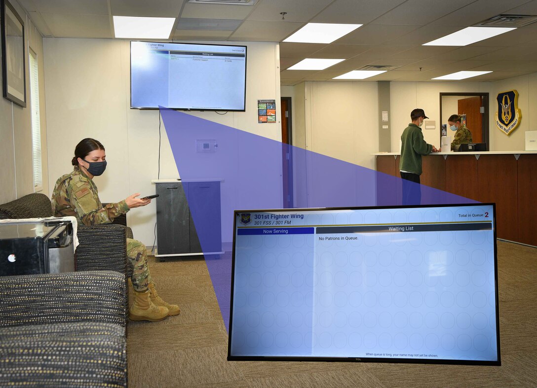 Senior Airman Lexi Smith 301st Fighter Wing Force Support Squadron customer support technician waits for her scheduled appointment using the wing's new Queue Kiosk system at U.S. Naval Air Station Joint Reserve Base Fort Worth, Texas. This system can be accessed via QR code scan, internet link and even the wing's app on Air Force Connect. Sign-up, check-in, with a few button clicks. (U.S. Air Force graphic by Jeremy Roman)