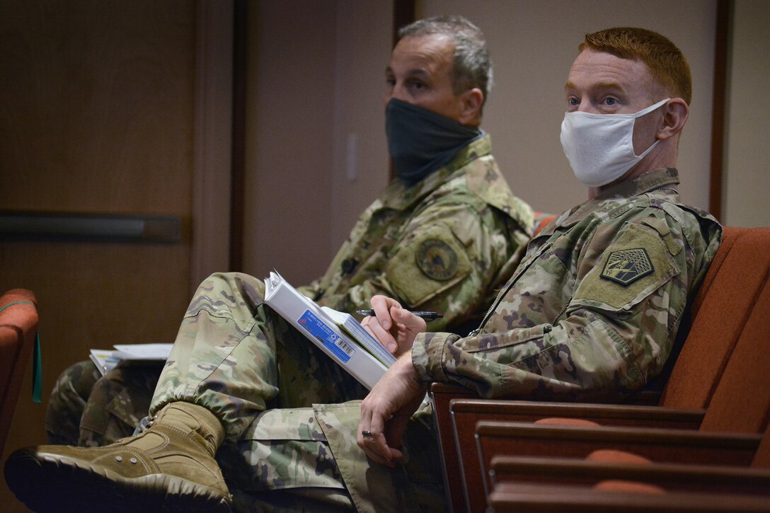 U.S. Army personnel listen during the U.S. Cyber Command and U.S. Army Warfighter Talks, May 12, 2021.