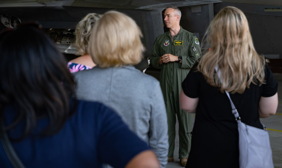 U.S. Air Force Col. David Foster, 1st Fighter Wing vice commander, briefs members of the Learn, Explore, Absorb and Disseminate (LEAD) Peninsula group about the F-22 Raptor aircraft at Joint Base Langley-Eustis, Virginia, May 20, 2021. The LEAD program members were shown an F-22 and its weapons systems, then briefed on the growing mission of the 1st FW.