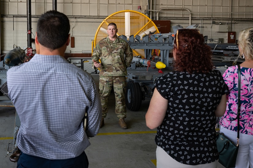 U.S. Air Force Master Sgt. Wes Daniel, 1st Maintenance Group weapons standardization team chief, explains the roles of different munitions to members of the Learn, Explore, Absorb and Disseminate (LEAD) Peninsula group during a visit to Joint Base Langley-Eustis, Virginia, May 20, 2021. LEAD Peninsula is a community program that stresses the importance of the private, public, and nonprofit sectors of the region by providing community leaders the opportunity to interface with one another.