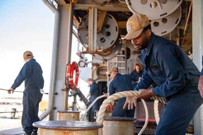 ROTA, Spain (May 21, 2021) Boatswain's Mate Seaman Bobby Mosley, assigned to the Harpers Ferry-class dock landing ship USS Carter Hall (LSD 50), handles line during a sea and anchor evolution, May 21, 2021. Carter Hall is operating in the Atlantic Ocean with Amphibious Squadron 4 and the 24th Marine Expeditionary Unit (MEU) as part of the Iwo Jima Amphibious Ready Group. (U.S. Navy photo by Mass Communication Specialist Seaman Sawyer Connally)