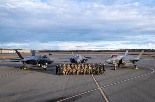 VX-9 Sailors, 354th Fighter Wing Airmen, and VMFA-122 Marine maintainers during an afternoon photo opportunity with their Joint Strike Fighters at Eielson AFB, AK during Northern Edge 21.