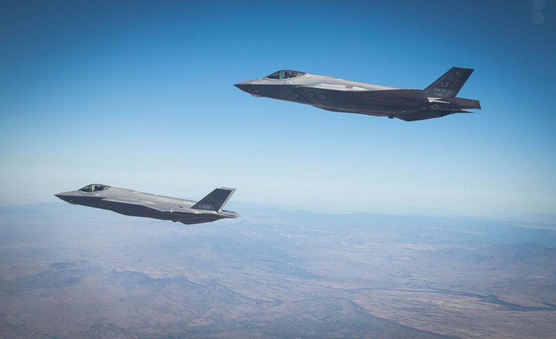 U.S. Air Force and Royal Danish Air Force F-35A Lightning II fighter jets assigned to the 308th Fighter Squadron, Luke Air Force Base, Arizona, fly in formation May 5, 2021, over Bagdad, Arizona.