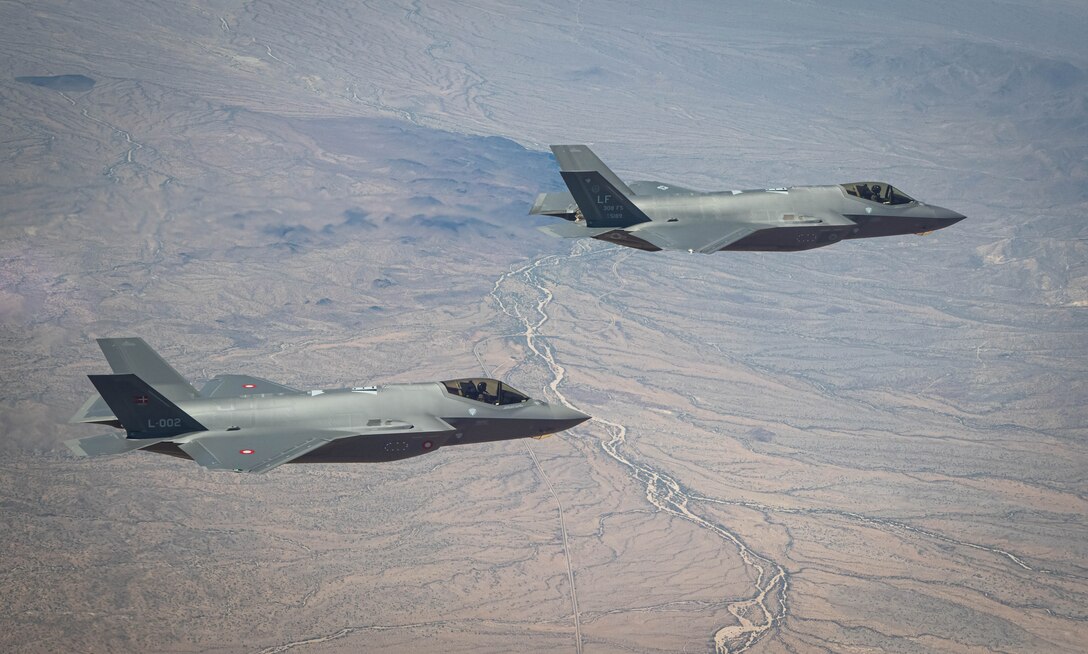 U.S. Air Force and Royal Danish Air Force F-35A Lightning II fighter jets assigned to the 308th Fighter Squadron, Luke Air Force Base, Arizona, fly in formation May 5, 2021, over Bagdad, Arizona.