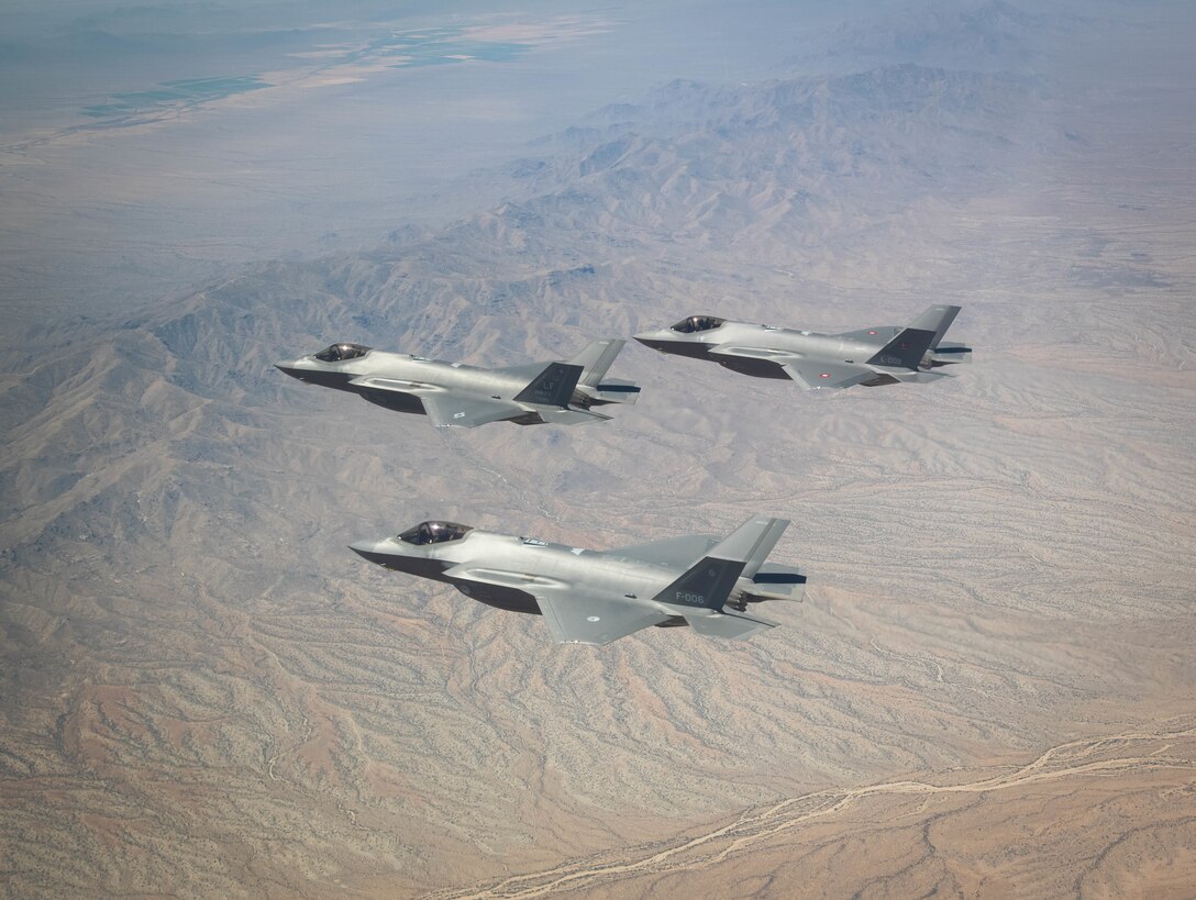 U.S. Air Force, Royal Danish Air Force and Royal Netherlands Air Force F-35A Lightning II fighter jets assigned to the 308th Fighter Squadron, Luke Air Force Base, Arizona, fly in formation May 5, 2021, over Bagdad, Arizona.