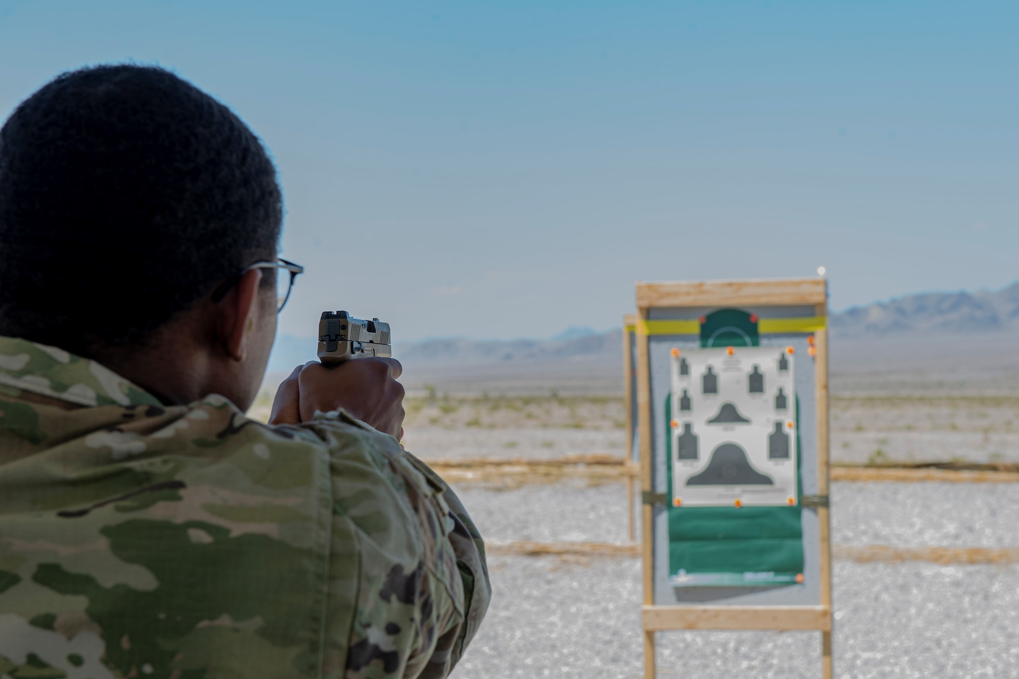 432nd Security Forces Squadron members take aim at a target for the security forces shooting competition
