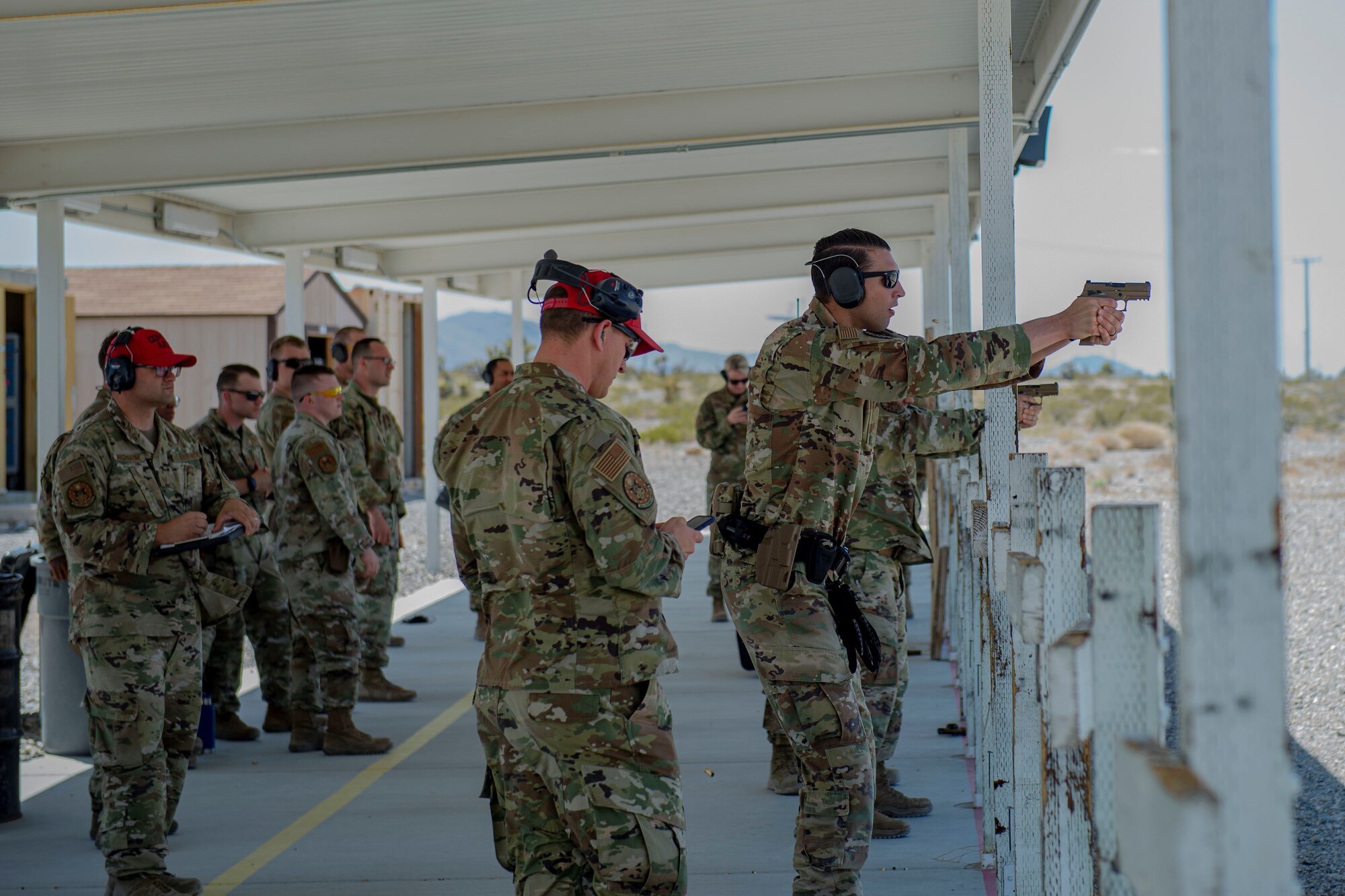 432nd Security Forces Squadron members take aim at a target for the security forces shooting competition