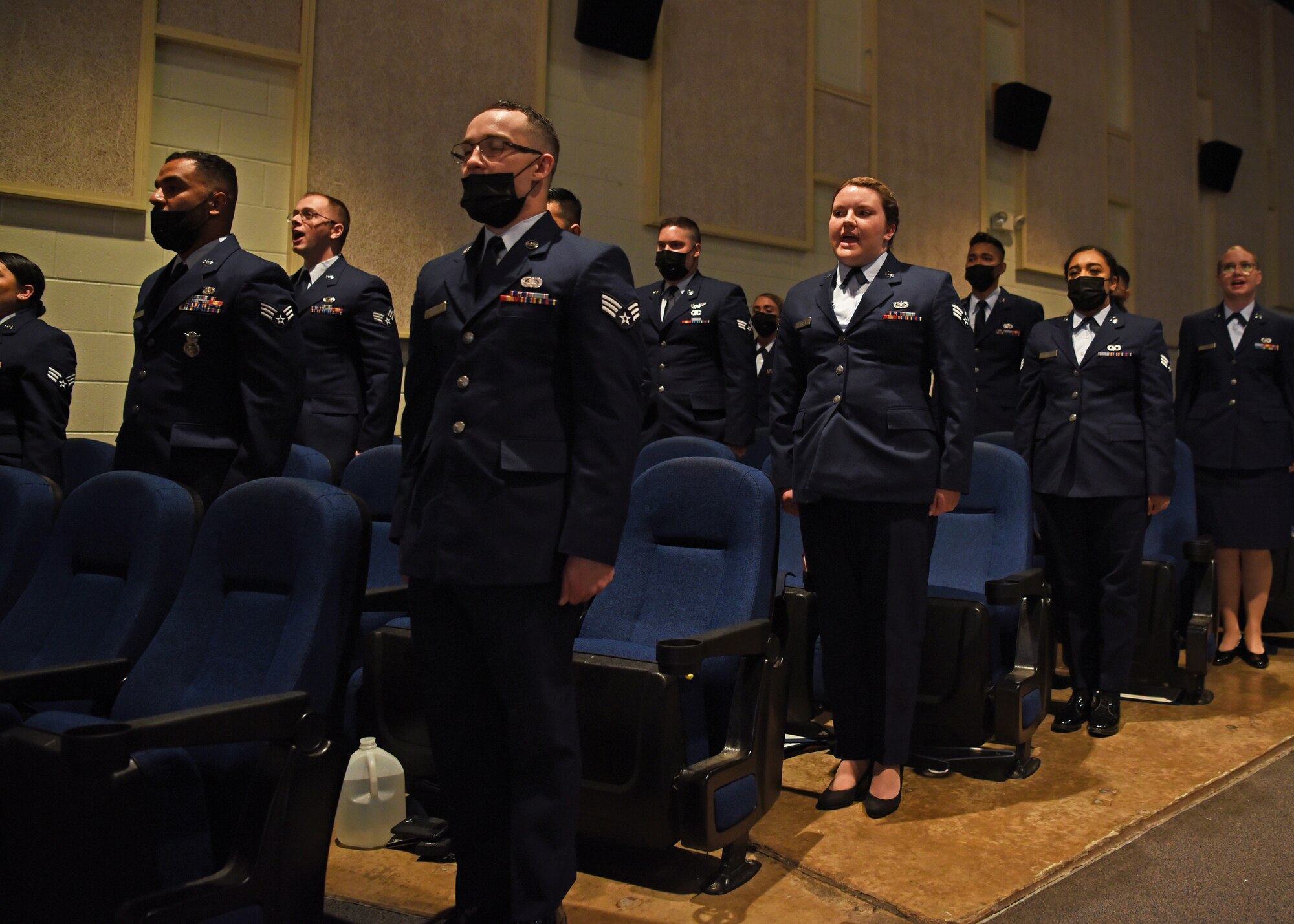 Airman Leadership School graduates, Class 21-D, recite the Airman’s Creed during their ALS graduation ceremony at the Base Theater, on Goodfellow Air Force Base, Texas, May 20, 2021. Class 21-D graduated 15 Airmen into front-line supervisors. (U.S. Air Force photo by Senior Airman Abbey Rieves)