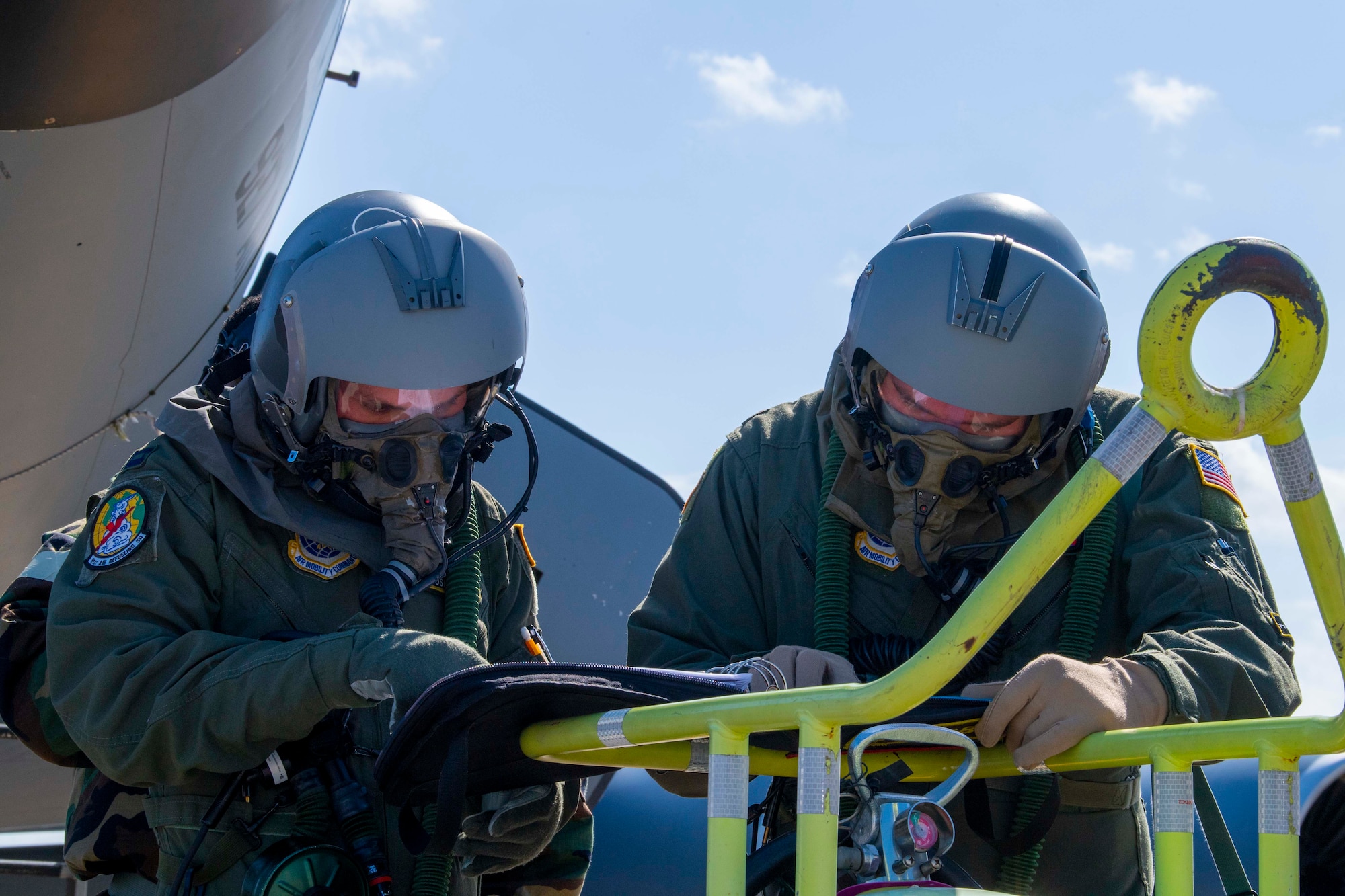 KC-135 Stratotanker aircraft pilots with the 91st Air Refueling Squadron (ARS) perform pre-flight checks during a large-scale readiness exercise (LRE), at MacDill Air Force Base, Florida, May 20, 2021. The 91st ARS also took part in phase two of the LRE to practice providing air refueling in a simulated contested environment.  (U.S. Air Force photo by Airman 1st Class Hiram Martinez)
