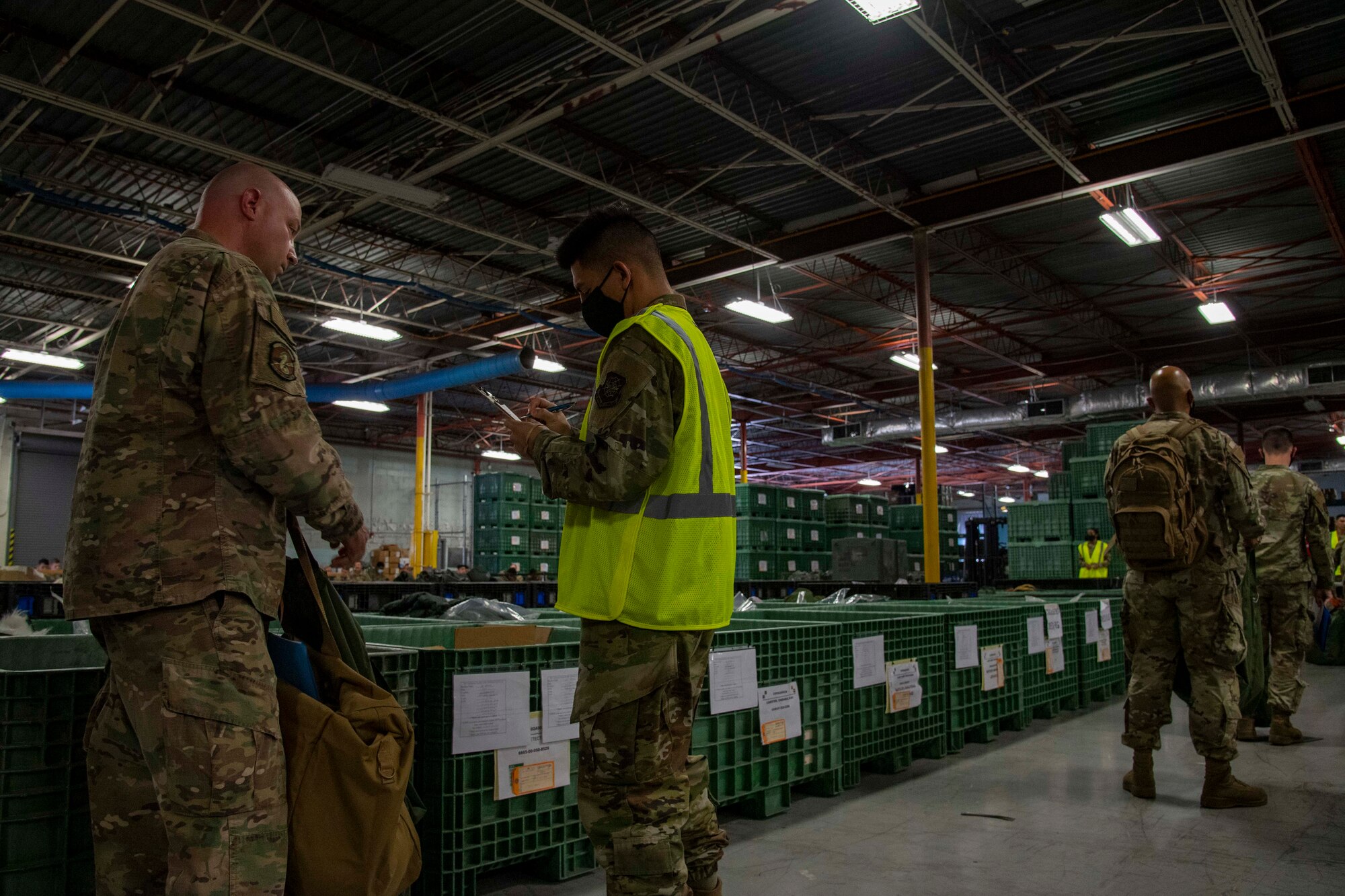 U.S. Air Force Airmen from the 6th Logistics Readiness Squadron hold a personnel deployment function (PDF) line, at the start of a large-scale readiness exercise at MacDill Air Force Base, Florida, May 18, 2021. The PDF line ensures Airmen are ready to deploy at a moment’s notice. (U.S. Air Force photo by Airman 1st Class Hiram Martinez)
